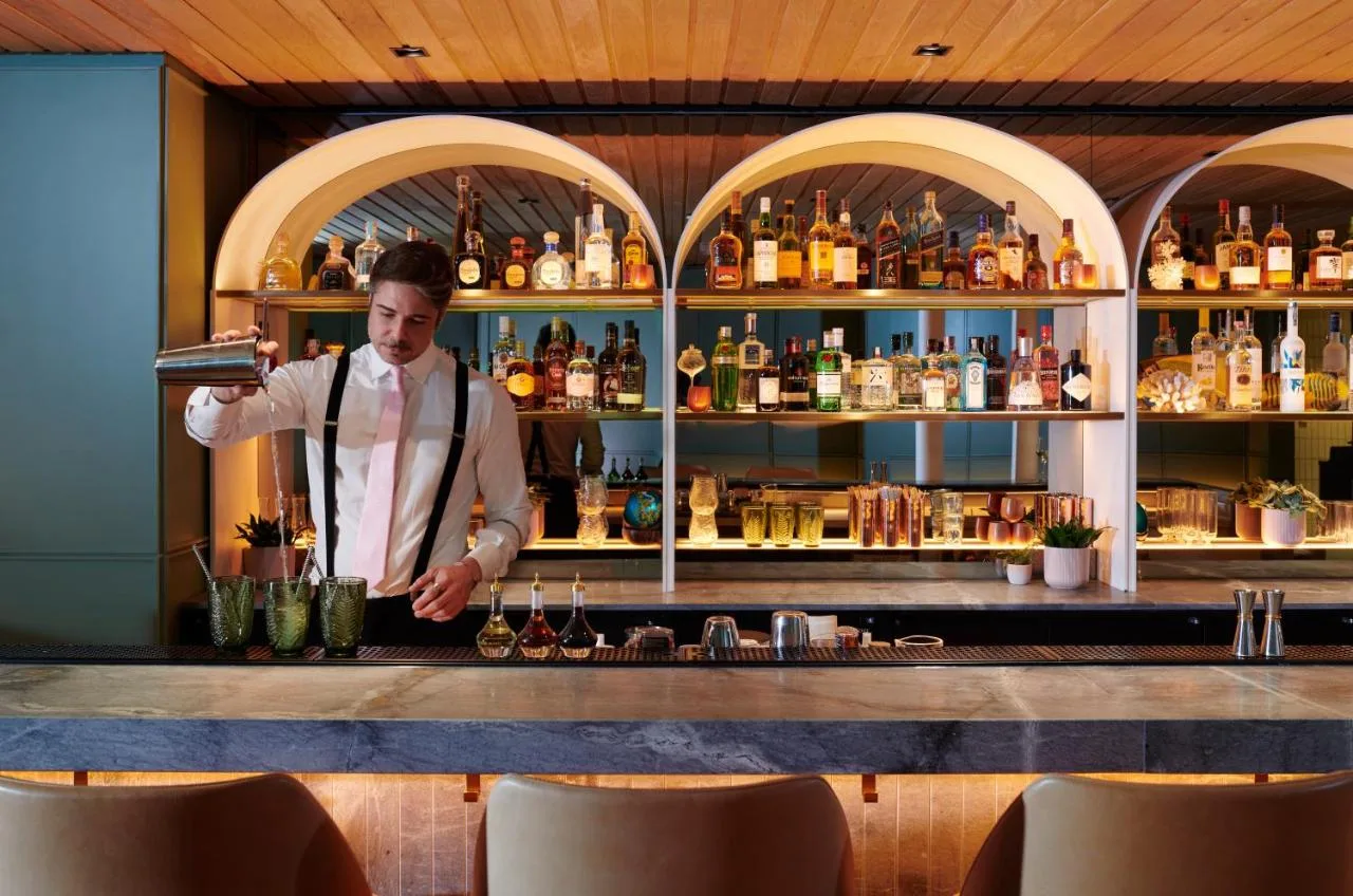 Bartender preparing a drink at the hotel bar at St. James' Court, A Taj Hotel, London